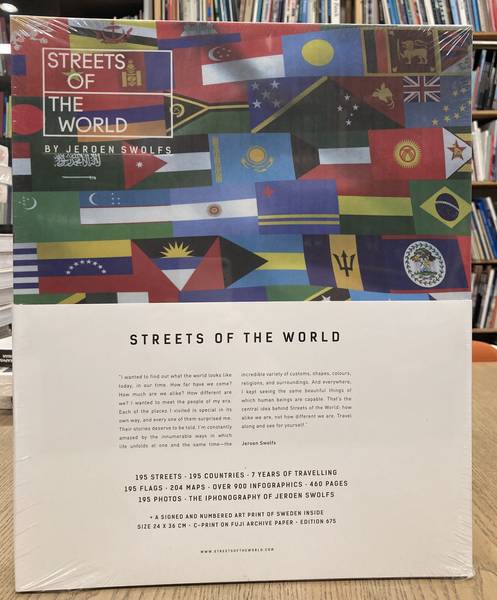 SWOLFS, JEROEN. Streets of the World. 195 streets, 195 countries, 7 years of travelling, 195 flags, 204 maps, over 900 infographics, 460 pages, 195 photos + the iphonography of Jeroen Swolfs. A signed and numbered art print of Sweden inside, size 24 X 36 cm, C-print on F